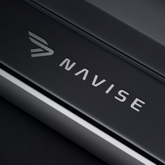 Navise Yachts logo design in metallic finish on dark surface, created by Artevium