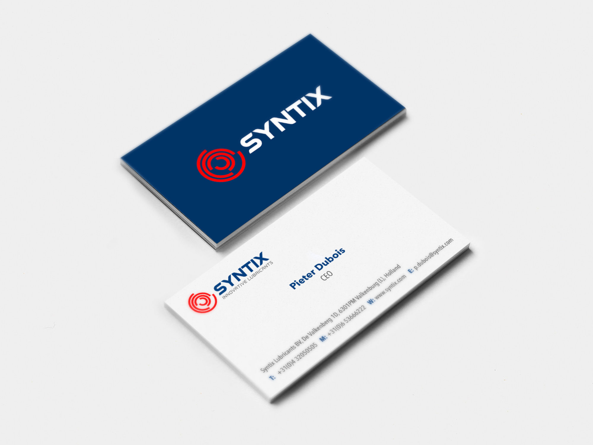 Front and back of the Syntix business card featuring the logo, custom typography, and brand colors