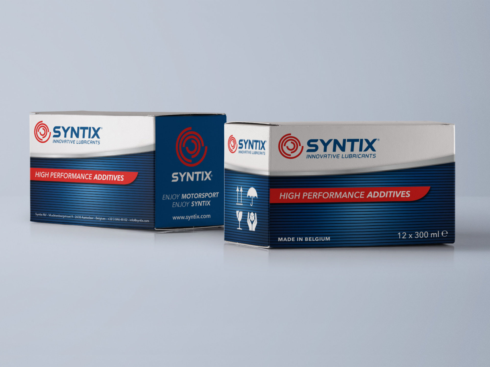 Syntix motor oil packaging boxes with branded design in red and blue, showcasing logo and product information